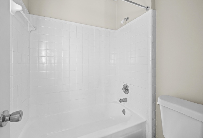 Full bathroom featuring shower / bathtub combination and toilet