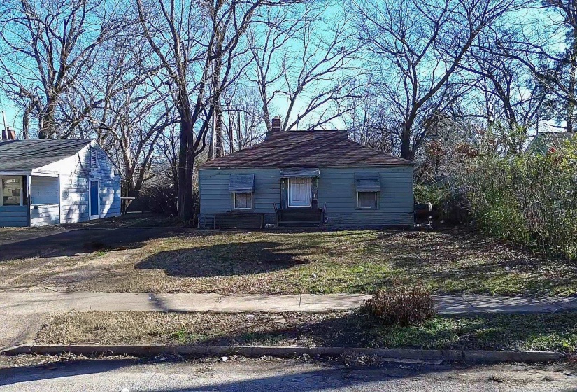 View of front of home with a chimney