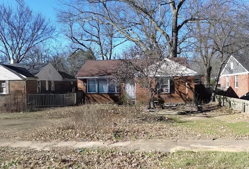 Back of house with brick siding