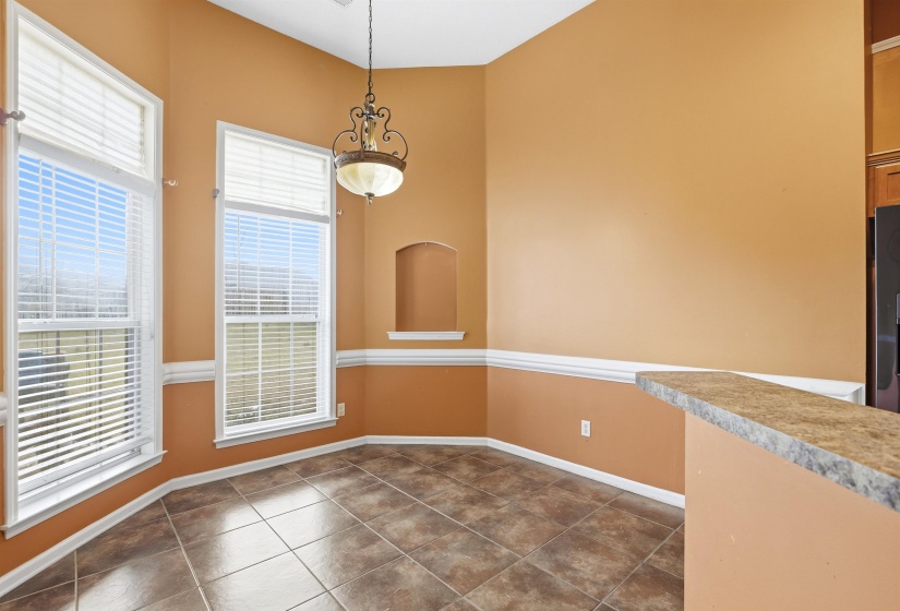Unfurnished dining area with baseboards