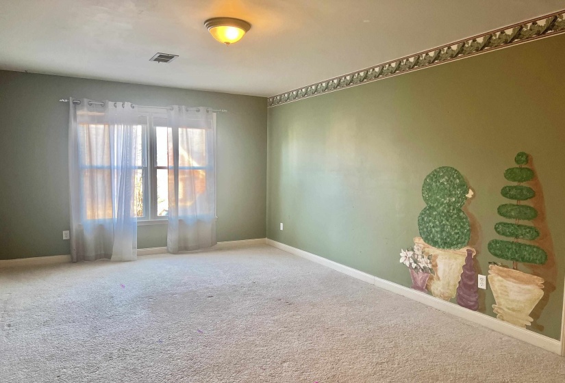 Unfurnished room with carpet flooring and baseboards