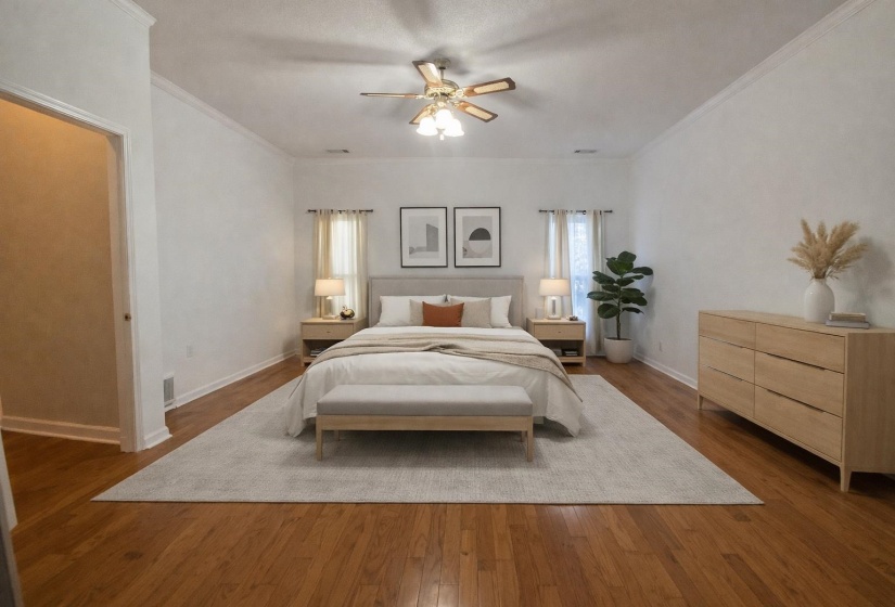 Bedroom featuring hardwood / wood-style flooring, crown molding, and ceiling fan