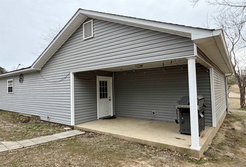 Rear view of property featuring a patio area