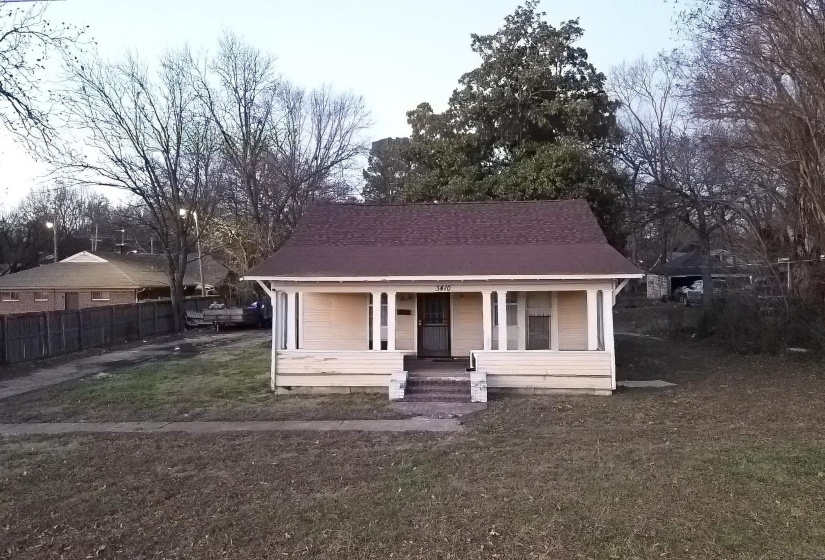 Bungalow-style home featuring a porch and roof with shingles