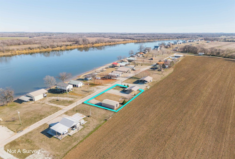 View of property location featuring a large body of water and property parcel outlined