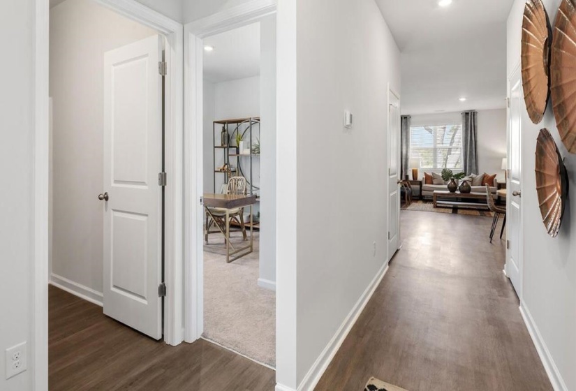 Corridor featuring dark wood-style flooring and recessed lighting