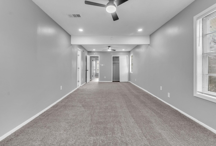 Unfurnished room featuring carpet floors, recessed lighting, and a ceiling fan