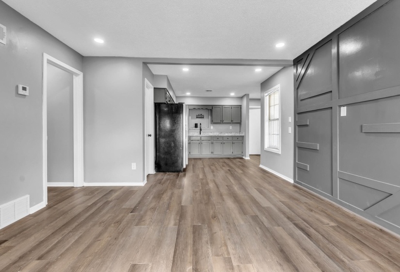 Unfurnished living room with light wood finished floors and recessed lighting