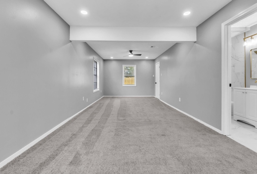 Carpeted empty room featuring recessed lighting and ceiling fan