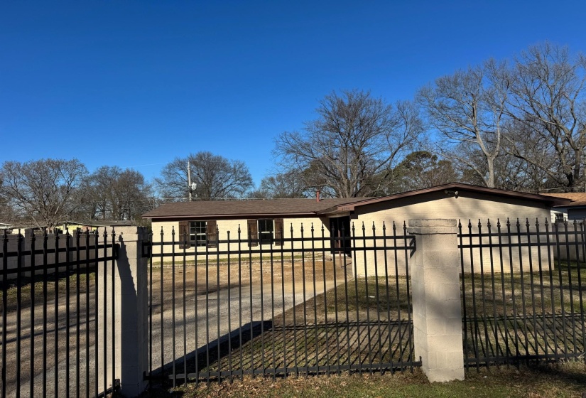 Gate featuring a fenced front yard