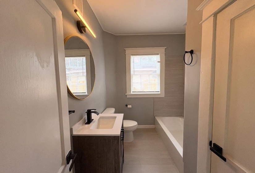Bathroom featuring vanity and bathtub / shower combination