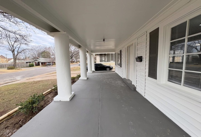 Covered porch with a residential view