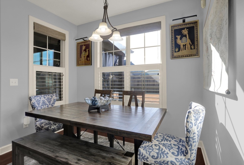 Dining space featuring baseboards and wood finished floors