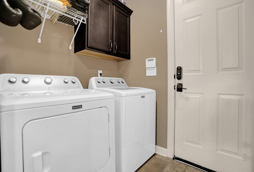 Laundry area with cabinet space and washing machine and dryer