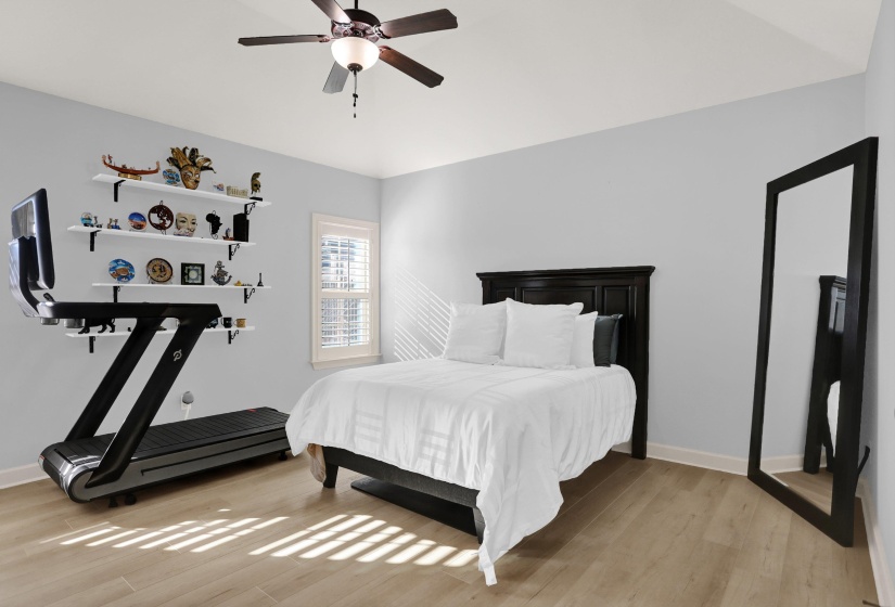 Bedroom featuring light wood-style flooring and ceiling fan