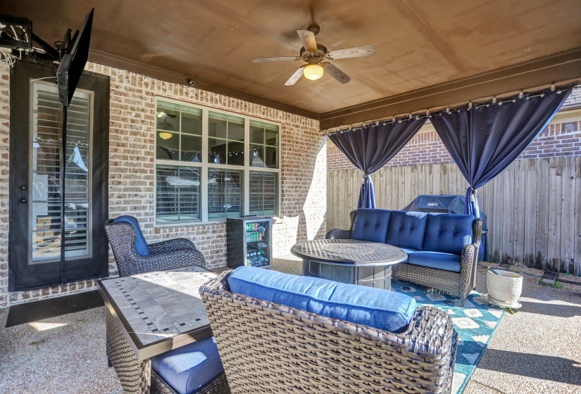 View of patio / terrace with ceiling fan and an outdoor living space