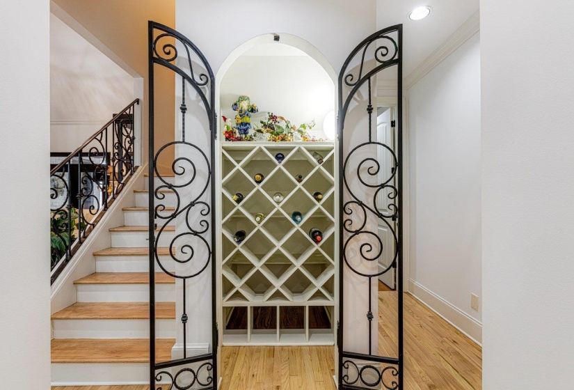Wine room featuring light wood-style floors and baseboards