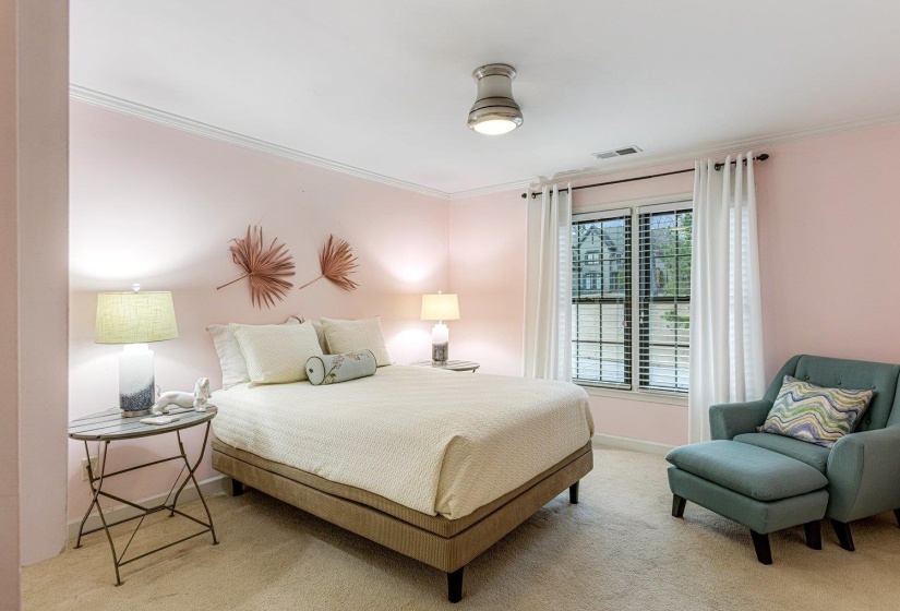 Bedroom with carpet flooring and crown molding