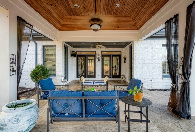 View of patio with outdoor lounge area and a ceiling fan