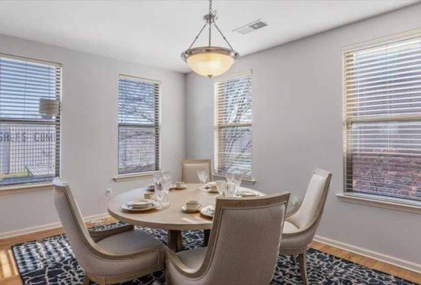 Dining area featuring baseboards and wood finished floors