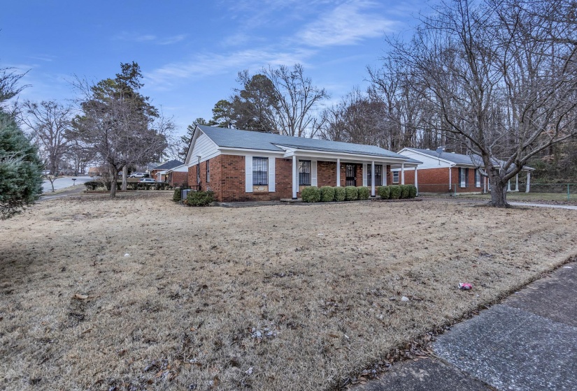 Single story home with brick siding and covered porch