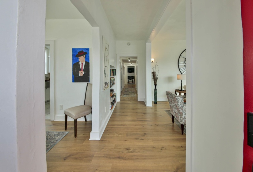 Hallway with light wood finished floors and baseboards