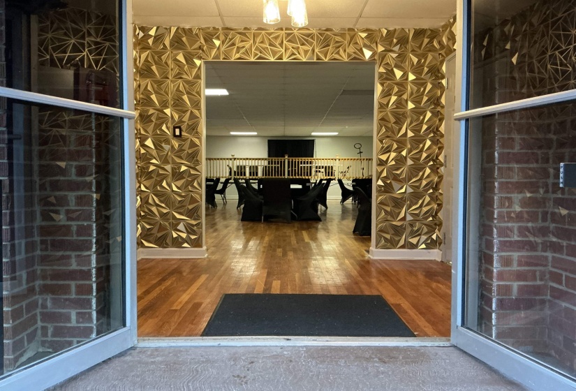 Doorway to property featuring outdoor dining space