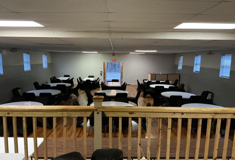 Dining area featuring a drop ceiling and wood finished floors