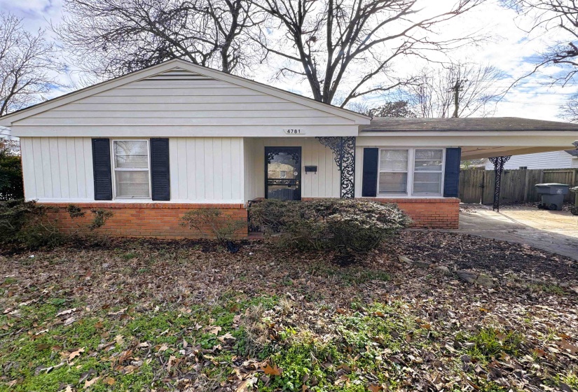 Bungalow-style house featuring brick siding, an attached carport, and a porch