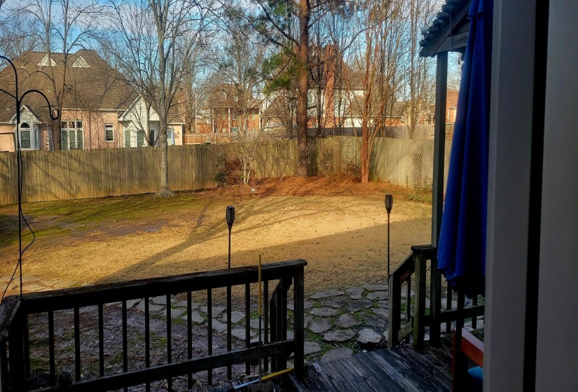 Fenced backyard with a residential view