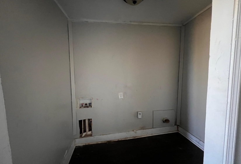 Laundry room featuring hookup for a washing machine and concrete floors