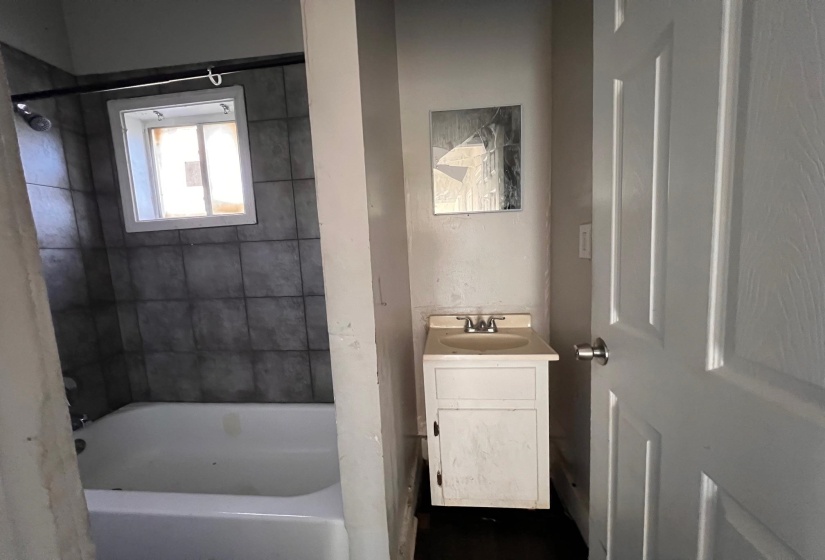 Bathroom featuring vanity and shower / tub combination