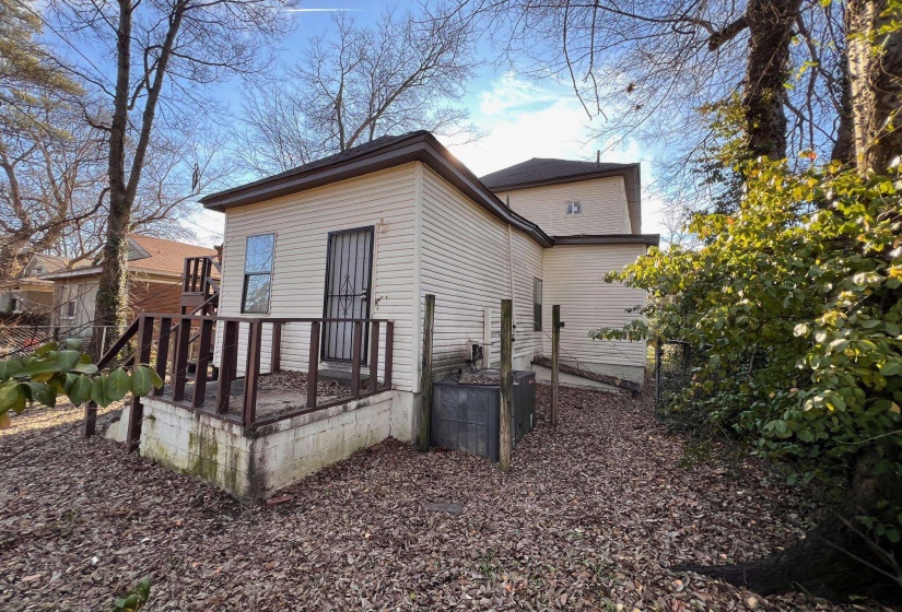 Rear view of house with a wooden deck