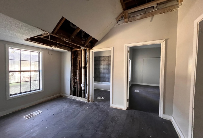 Unfurnished bedroom with baseboards