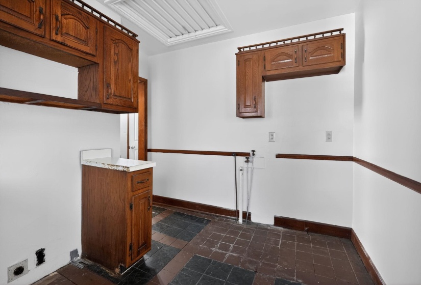 Laundry area with baseboards