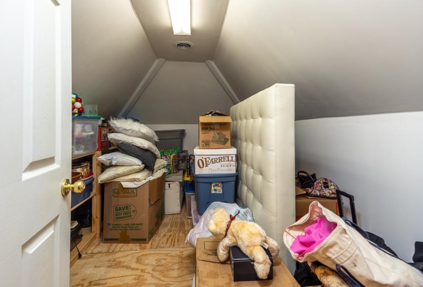 Although hard to see, there is more storage through the door in this room.