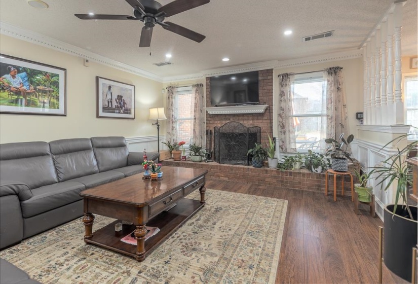 Brick Fireplace and hardwood floors!