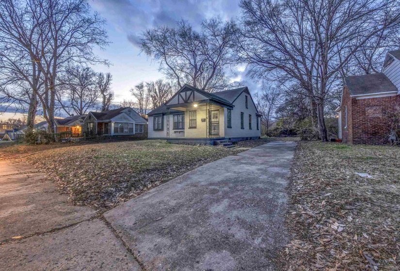 Bungalow-style home with a front yard