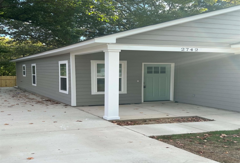 Doorway to property with covered porch