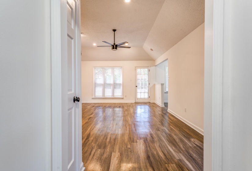 Unfurnished room featuring lofted ceiling, dark wood-style floors, a ceiling fan, and recessed lighting