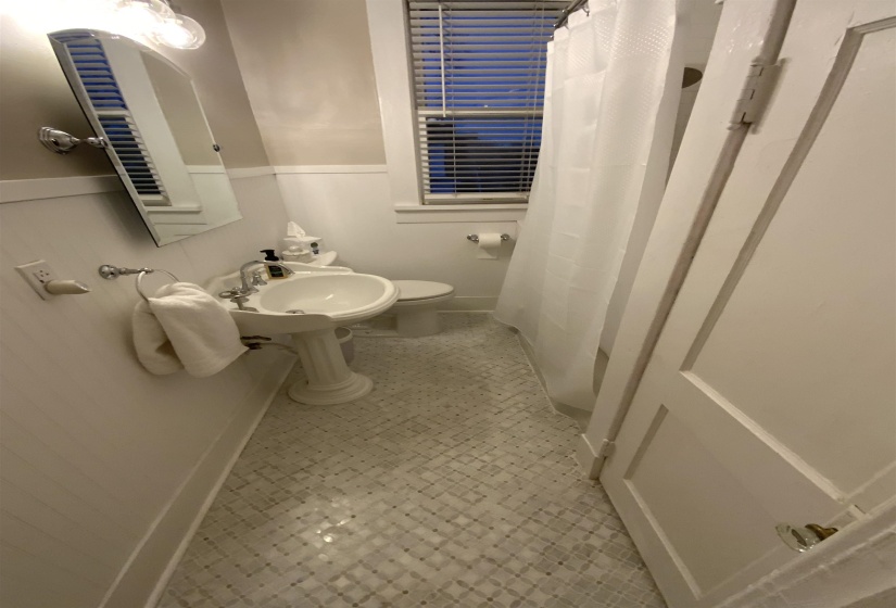 Bathroom with a shower with curtain