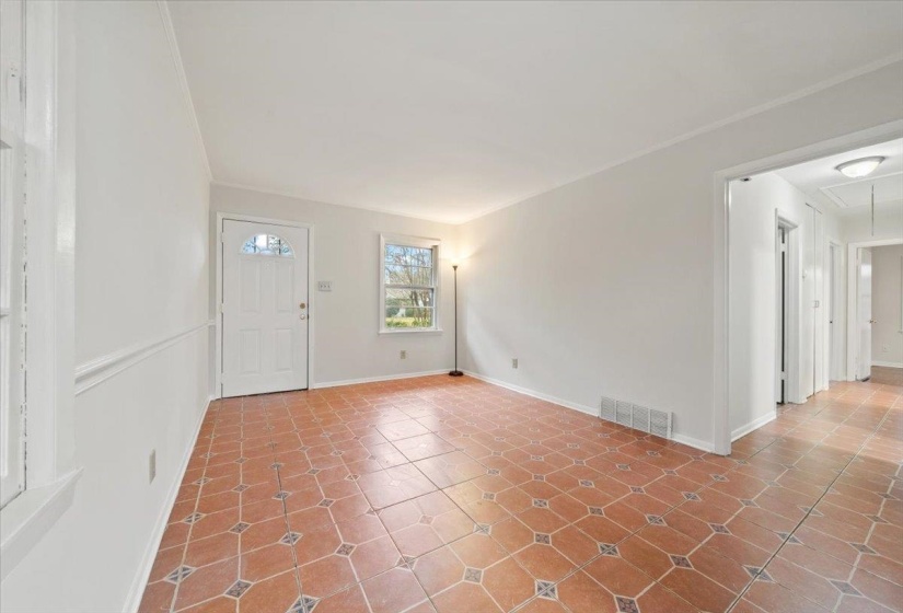 Entryway featuring baseboards and tile patterned floors