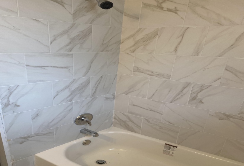 Bathroom with bathing tub / shower combination