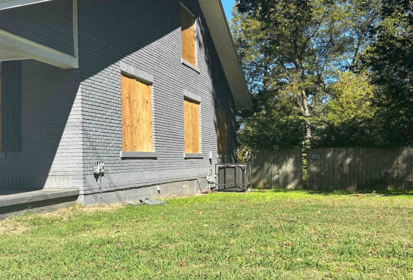 View of side of home with brick siding