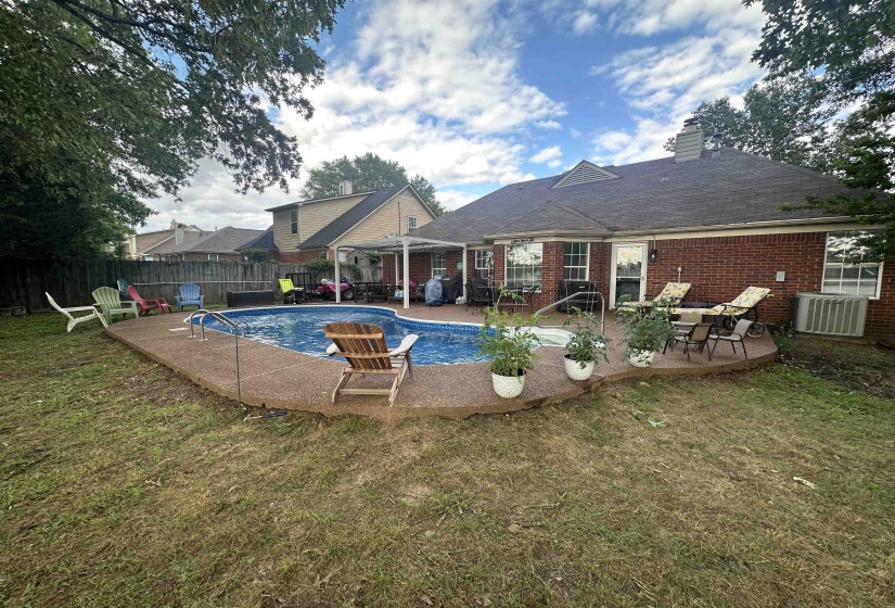 View of pool featuring a patio, a fenced backyard, and area for grilling