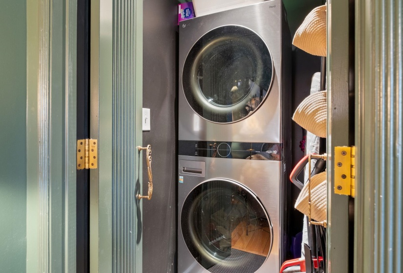 Laundry room with estacked washer and dryer