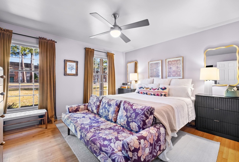 Bedroom with light wood-type flooring and a ceiling fan