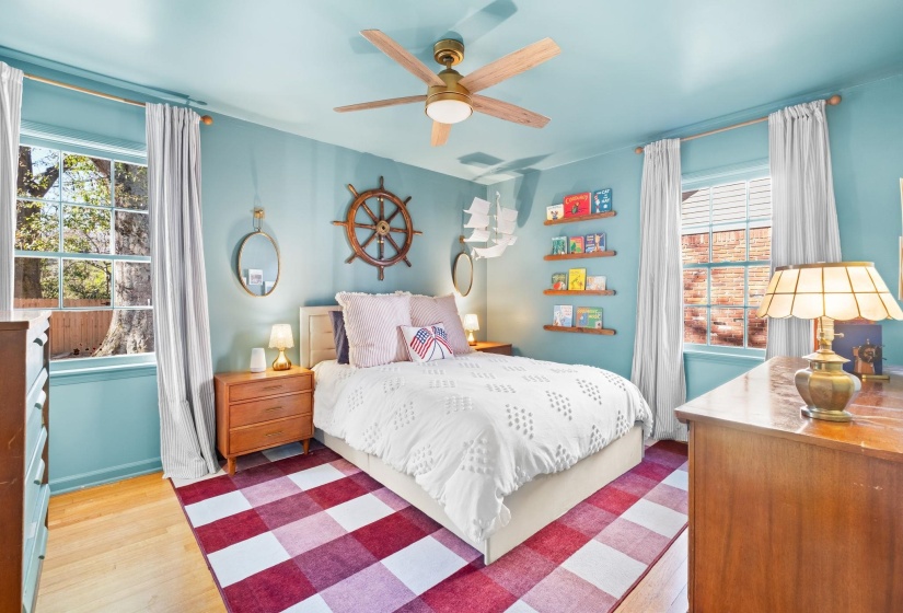 Bedroom with wood finished floors and a ceiling fan