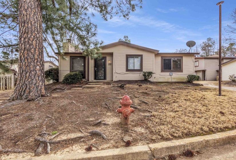 Ranch-style home featuring a chimney