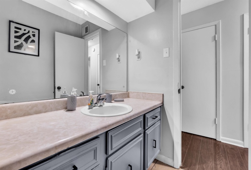 Bathroom with vanity and light wood finished floors